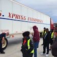 drivers looking at a U.S. Xpress trailer