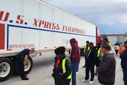 drivers looking at a U.S. Xpress trailer