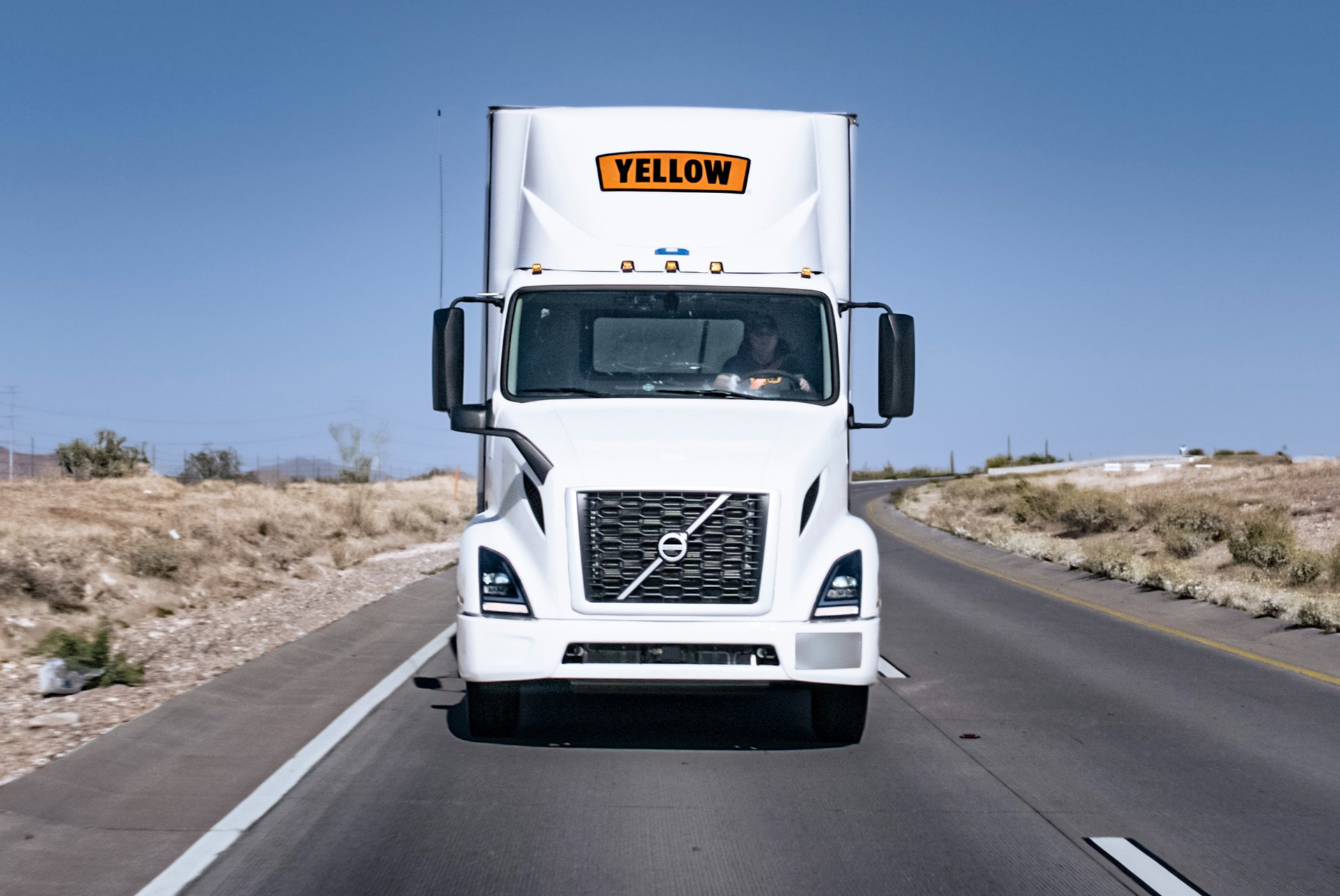 Yellow truck on the road