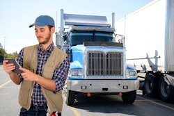 Truck driver looking at a tablet