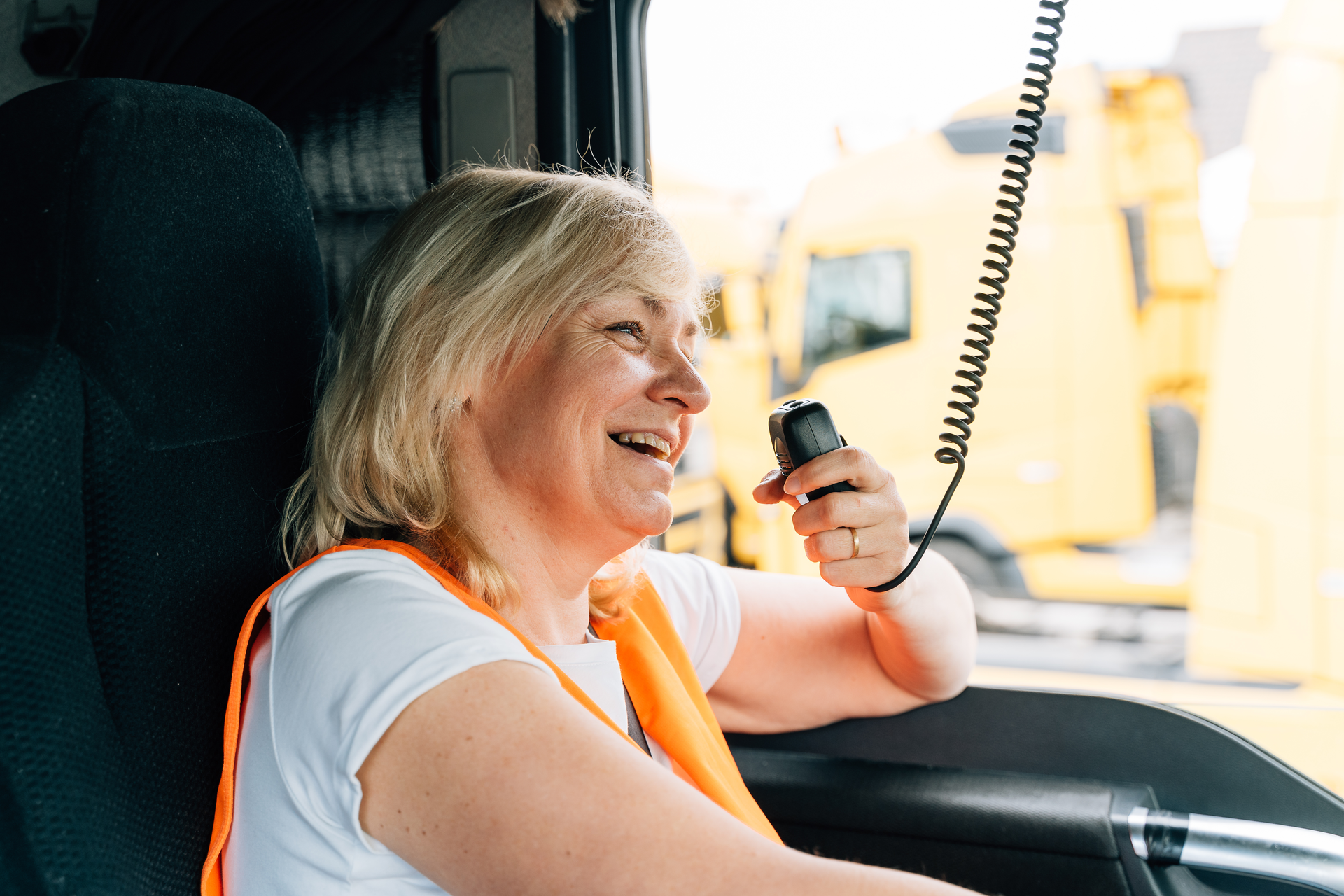 female truck driver using a CB radio