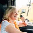 female truck driver using a CB radio