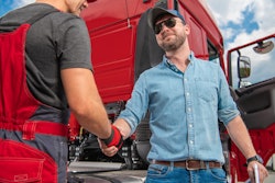 Truck driver shaking hands