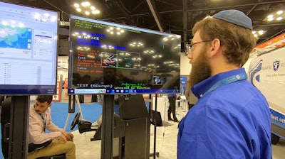 Mike Wineberg, director of DVR at Rear View Safety, a Safe Fleet company, demos blackout mode in MobileMule AI. Biometrics are used to identify Mike and his movements are tracked to help ensure safer driving habits. The screen on the left shows Jungo’s VuDrive cloud management platform which fleet managers can use to monitor driver performance.