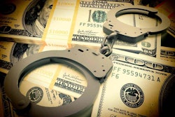 fraud money handcuffs