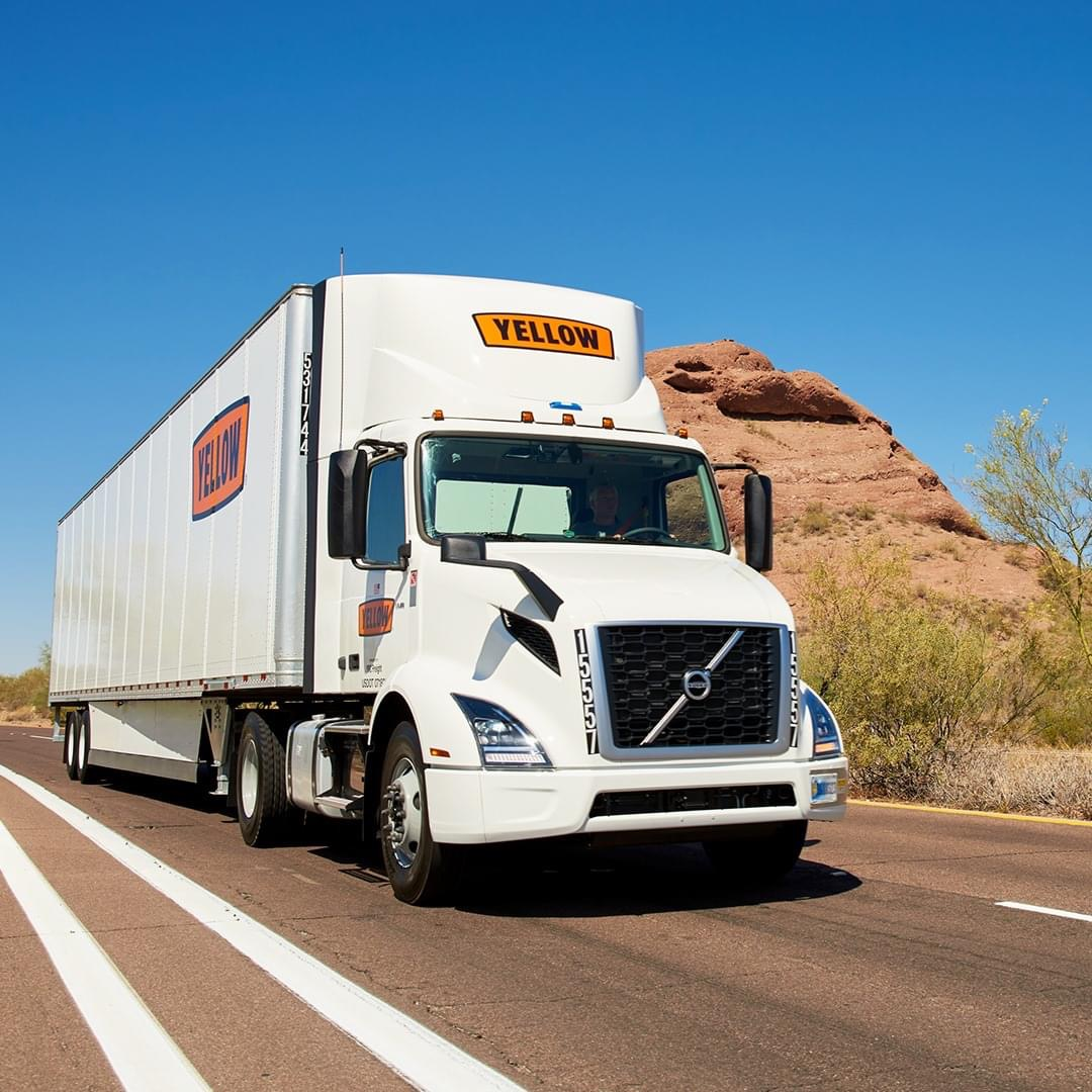 Yellow truck on highway
