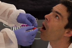 nurse collecting an oral fluid sample