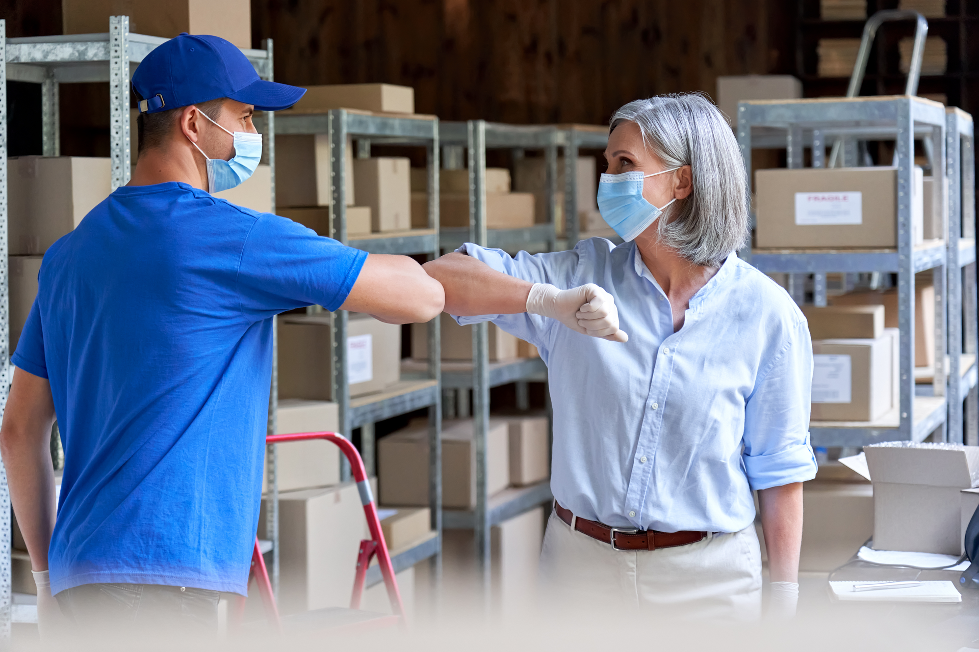 people bumping elbows instead of shaking hands