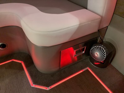 Refrigerator drawer below the rear seat