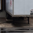 trailer parked at a warehouse dock