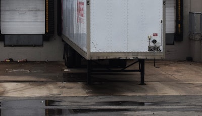 trailer parked at a warehouse dock