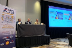 NACFE executive director Mike Roeth, right, talks with Jake VandeLoo vice president of equipment engineering at Schneider (center) and Drew Cullen, vice president of fuels and environmental affairs for Penske Truck Leasing.