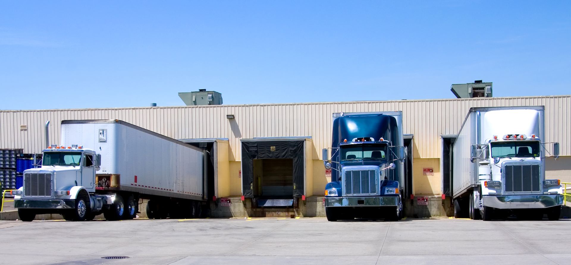 trucks sitting at a loading dock