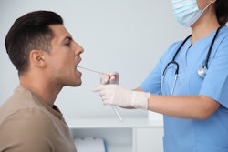 man getting oral swab drug test