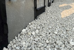 AeroAggregate's ultra-lightweight foamed glass aggregate beside concrete retaining wall