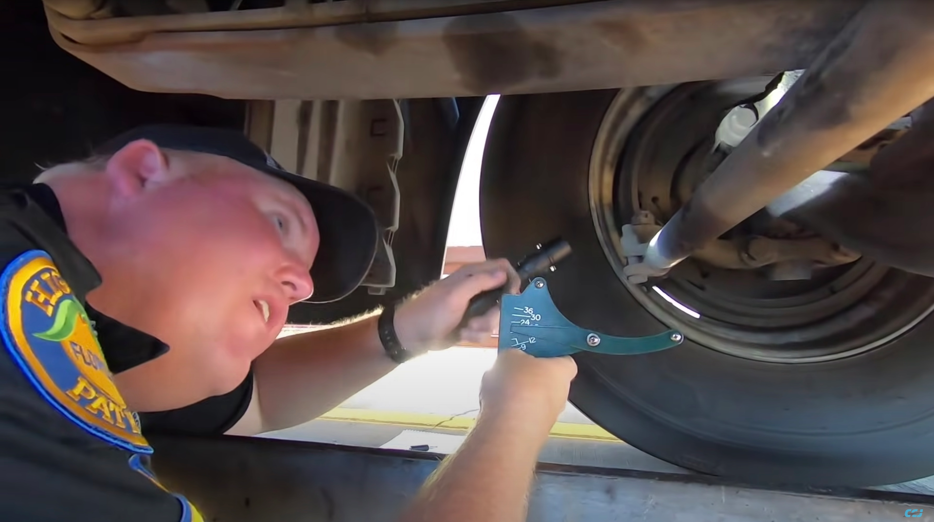 inspector checking brakes