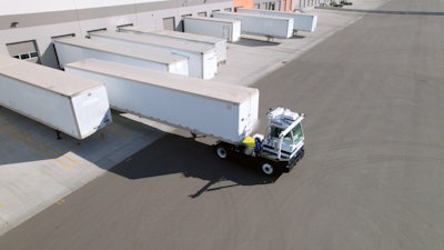 Outrider autonomous yard tractor backing into dock