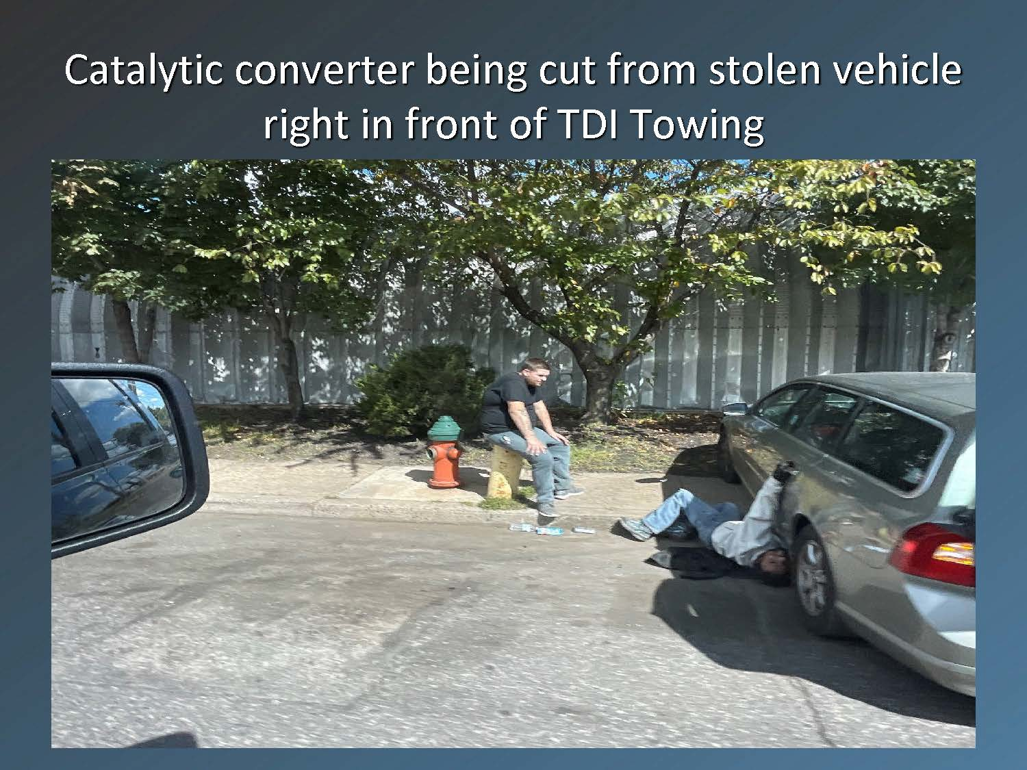 Catalytic converter being cut from a stolen vehicle in front of TDI Towing
