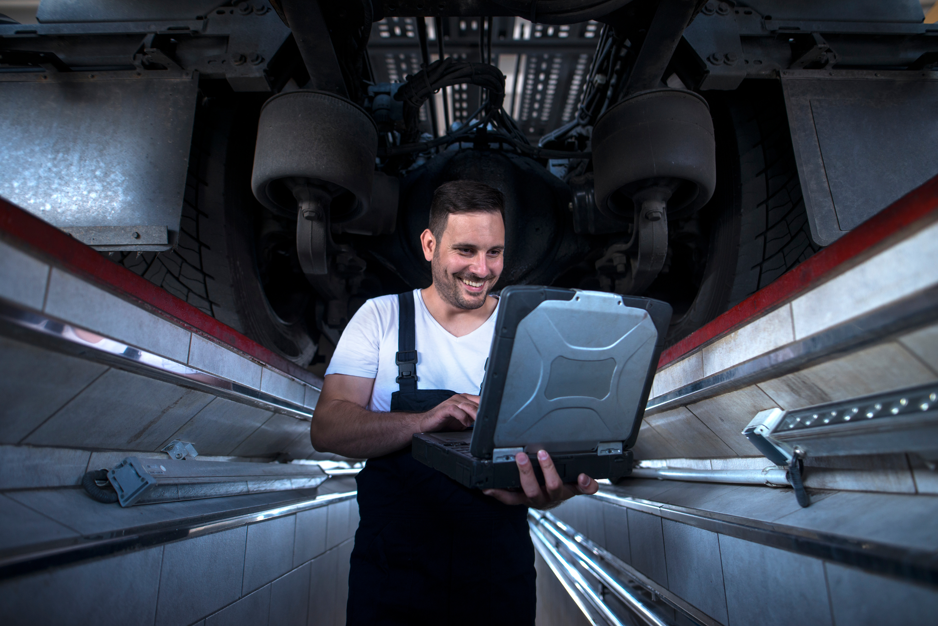 repair technician using a laptop