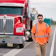 Trucker in a safety vest walking