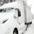 Semi covered in snow