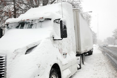 Semi covered in snow