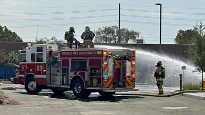 Firefighters dousing the nikola truck fire
