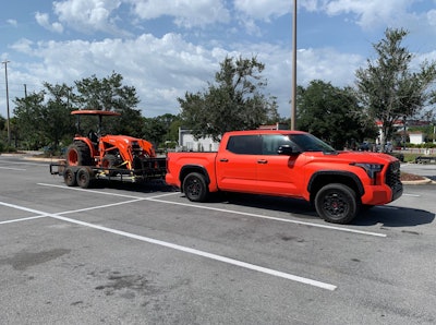 Never know where life will take you like doing a tow test with an orange 2023 Toyota Tundra and an orange Kubota tractor. Shortly after taking this a photo a guy stopped in his Ford F-150 and said Kubota orange was a close match to Toyota's solar octane. Have to admit the two look good together and got plenty of looks going down the road.