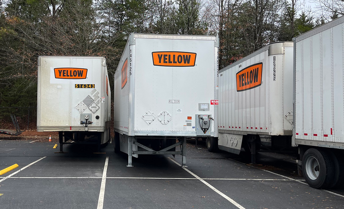 Yellow trailers in a lot