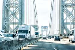 semi stuck in traffic on a bridge