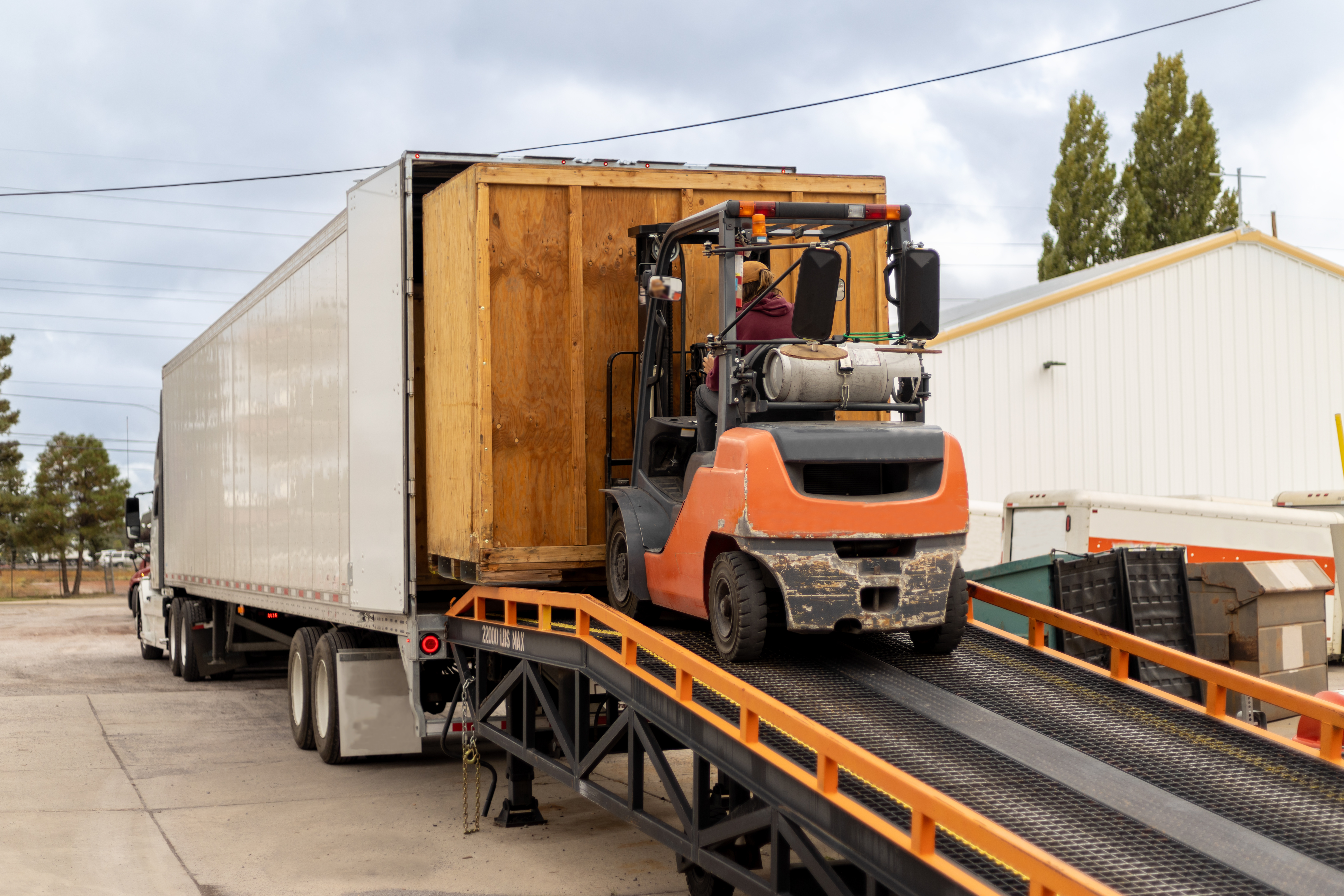 forklift loading a trailer