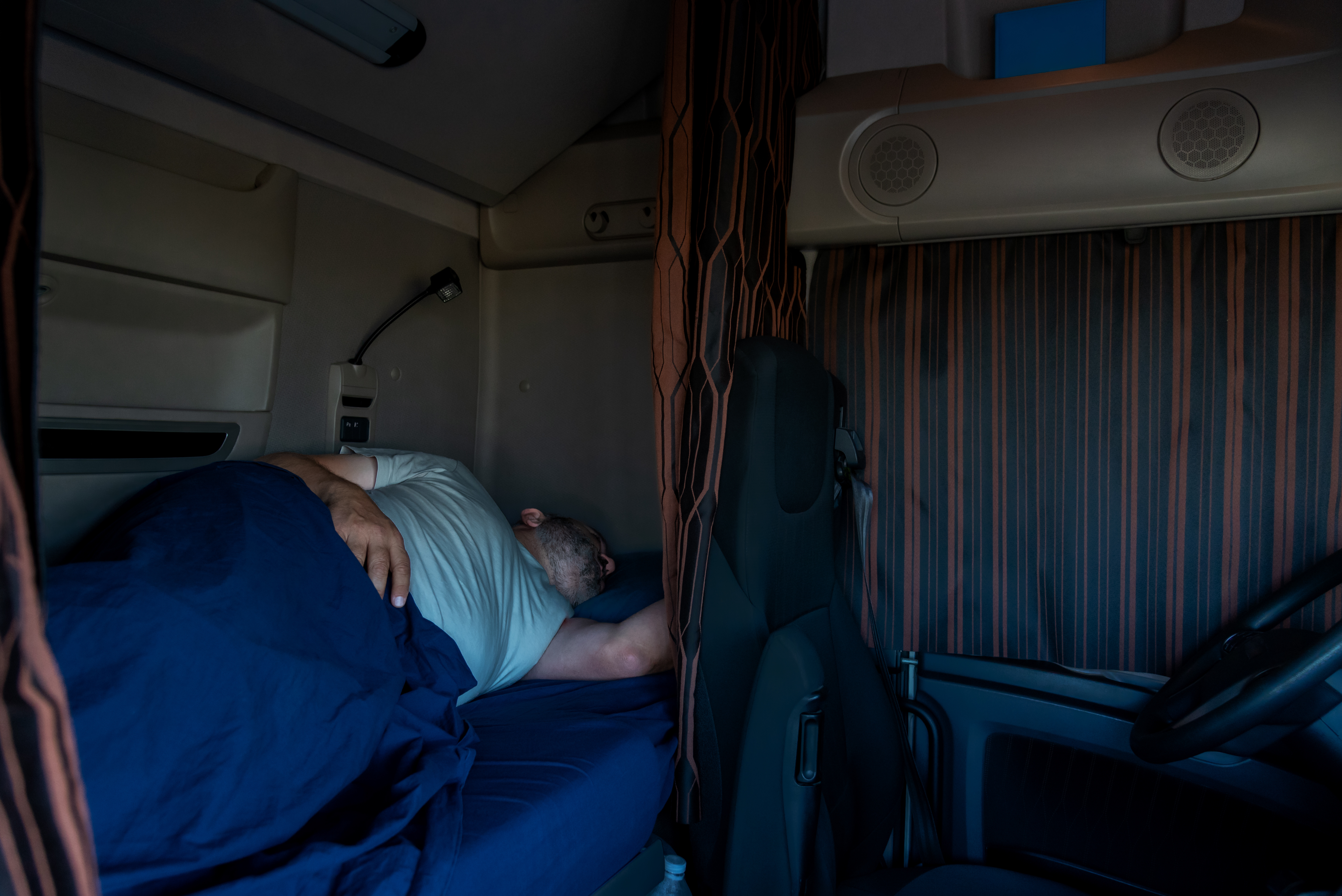 truck driver sleeping in his bunk
