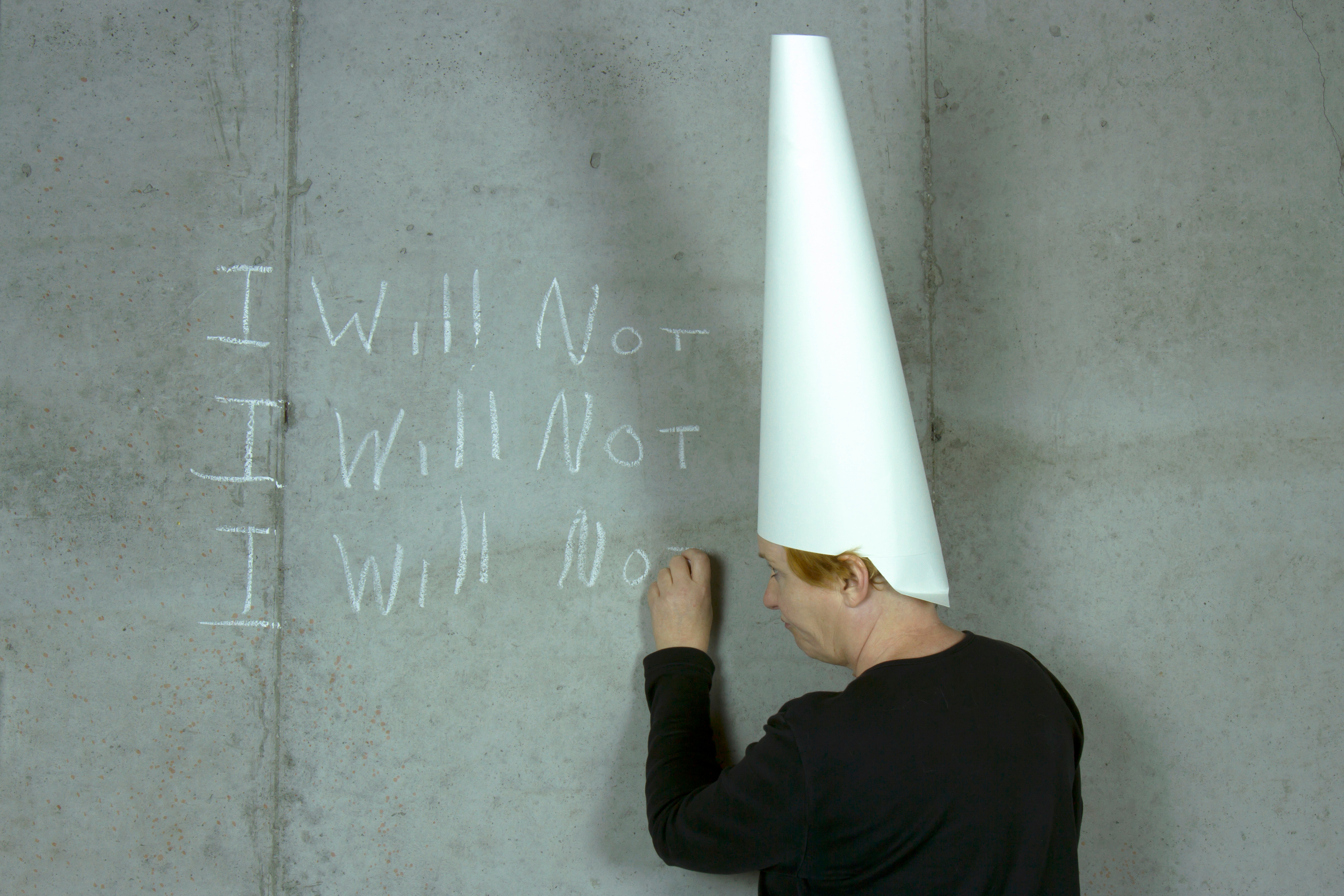 man in a dunce cap