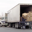 Driver unloading a truck