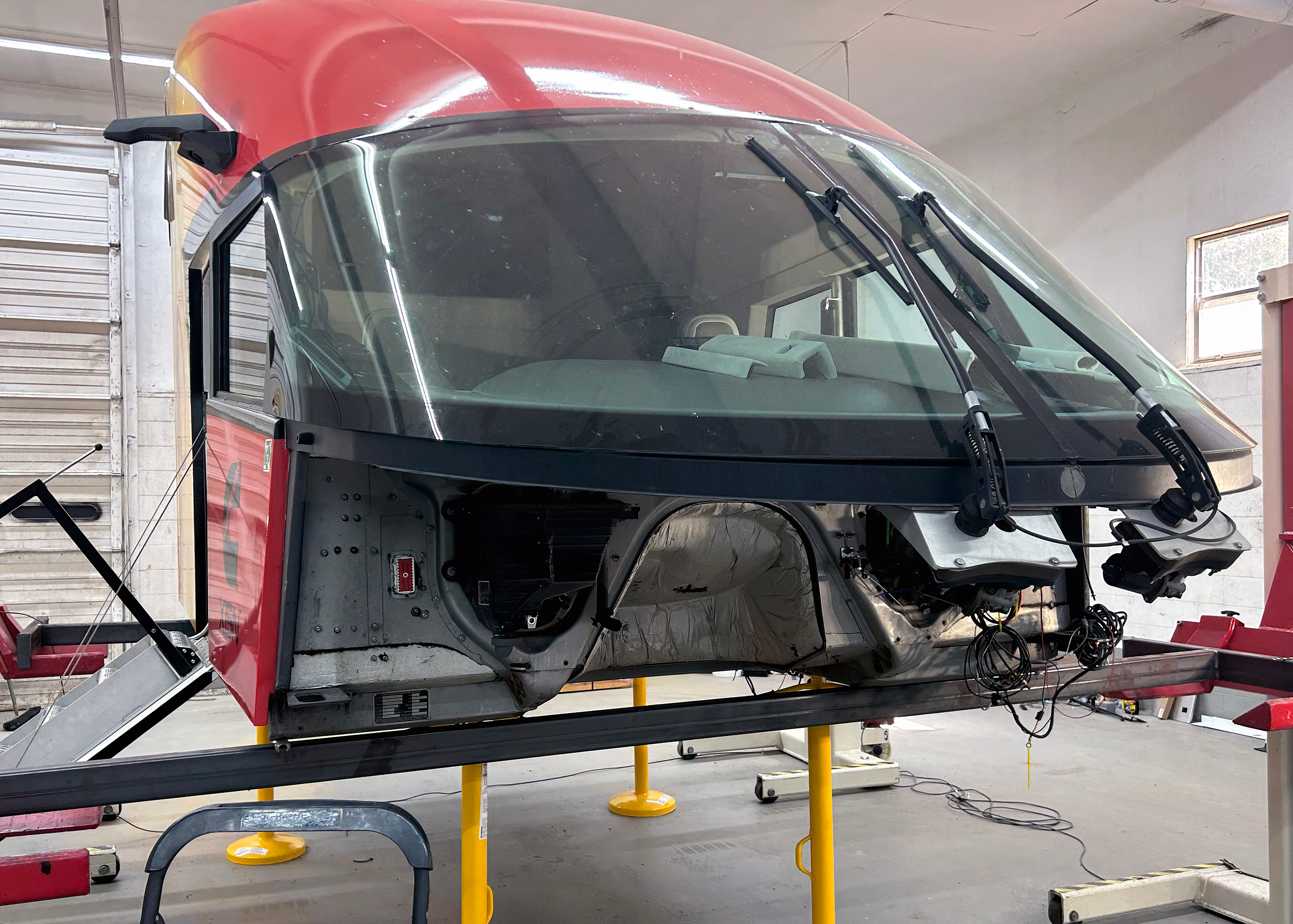 Starship's cab sits on a lift at SPEVCO while awaiting the chassis. Craig Tharpe, SPEVCO director of engineering and design, said it will take about a day to put the pieces together, and several more days to connect all the pieces and test them properly.