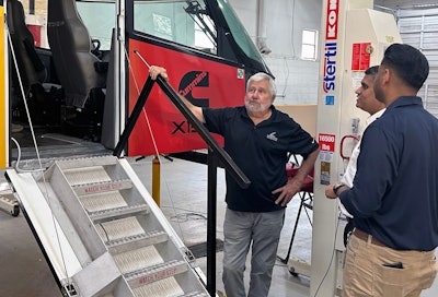 Craig Tharpe, SPEVCO's director of engineering and design, speaks with Puneet Jhawar, general manager, Cummins Global Spark Ignited and Fuel Delivery Business, and Ryan Manthiri, Engineering Manager for the Starship Program for Shell Global Solutions.