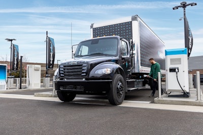 Freightliner electric truck at a charger