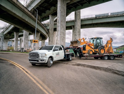 2024 Ram 5500 Chassis Cab SLT towing backhoe