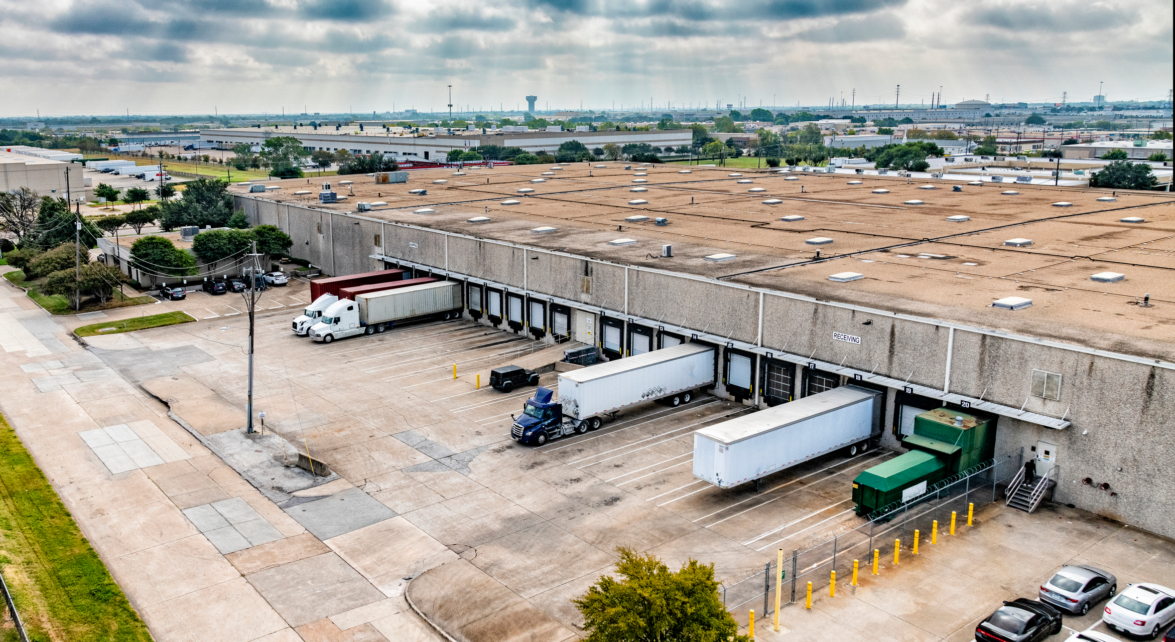 trucks getting loaded at a dock