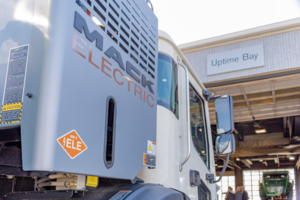 Mack electric truck pulling into shop