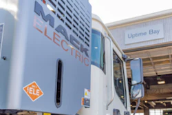 Mack electric truck pulling into shop