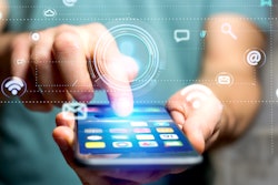 Businessman using a smartphone with a Contact icon surrounding by app and social icon - 3d render