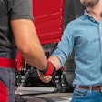 Truck driver shaking hands