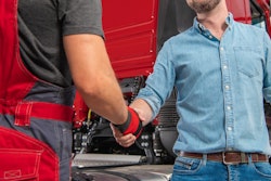 Truck driver shaking hands