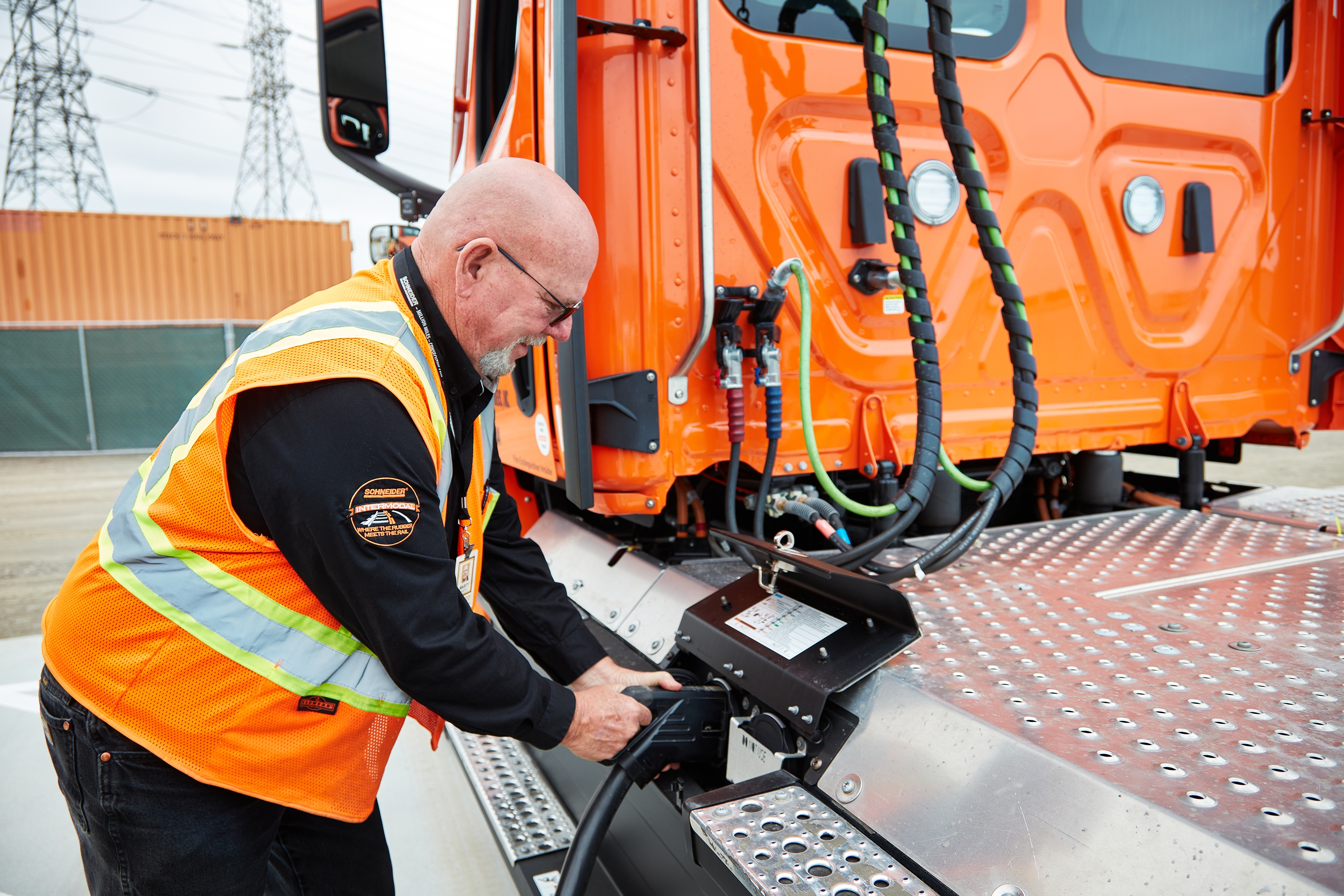 eCascadia driver at a charging station