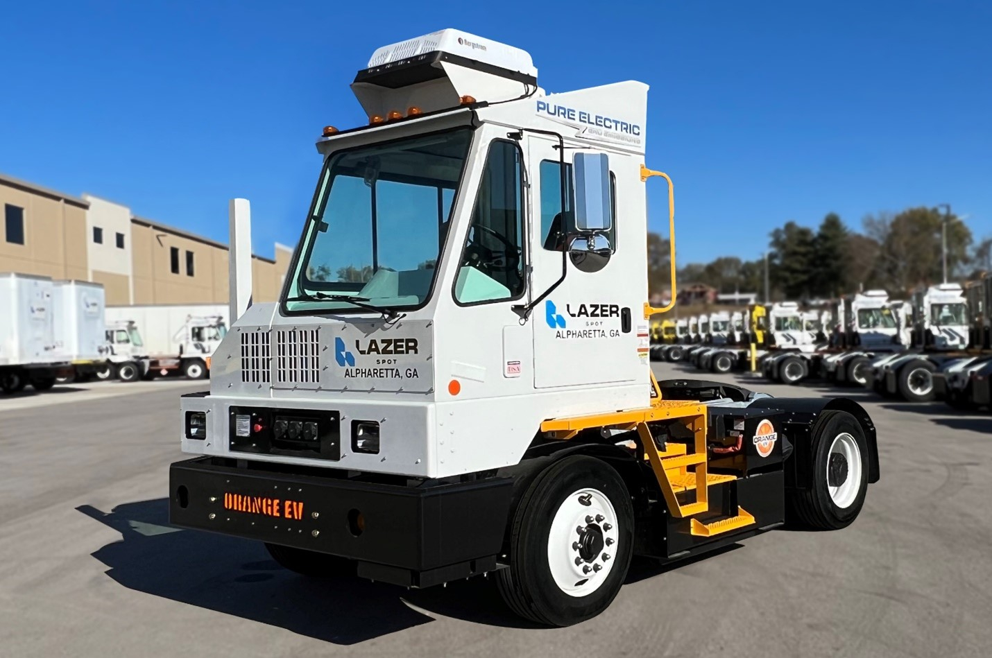 Orange EV terminal tractor Lazer Logistics