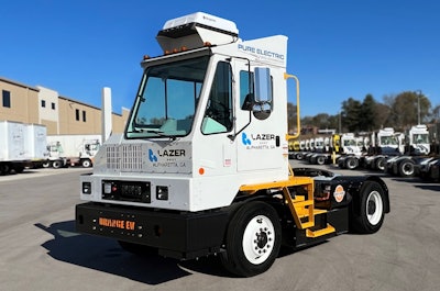 Orange EV terminal tractor Lazer Logistics