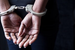 person in handcuffs