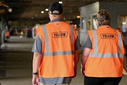 Yellow employees walking in a warehouse