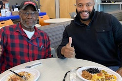 ACT Life Coach Dre Carnegie (right) is a familiar face in the carrier's cafe, which is located close to where drivers enter the building.
